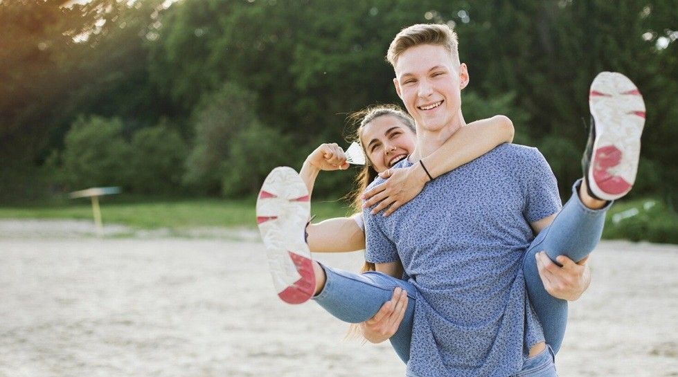 white knight syndrome - smiley couple having fun in nature