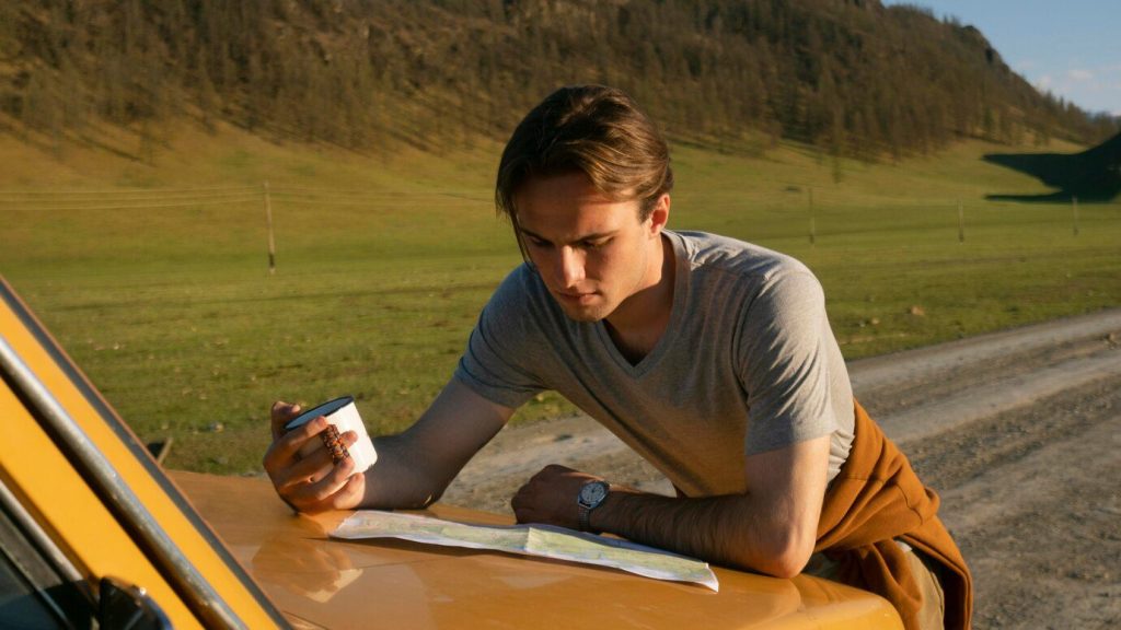 man reading map outdoors