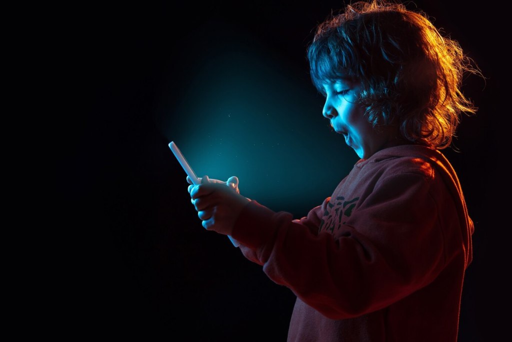 Boy vlogging with tablet