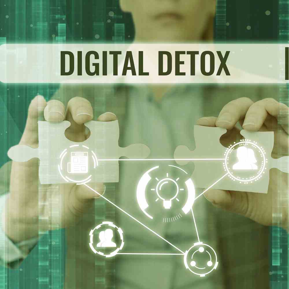 Person holding puzzle pieces with 'DIGITAL DETOX' tech graphics, for a digital detox guide in NYC.