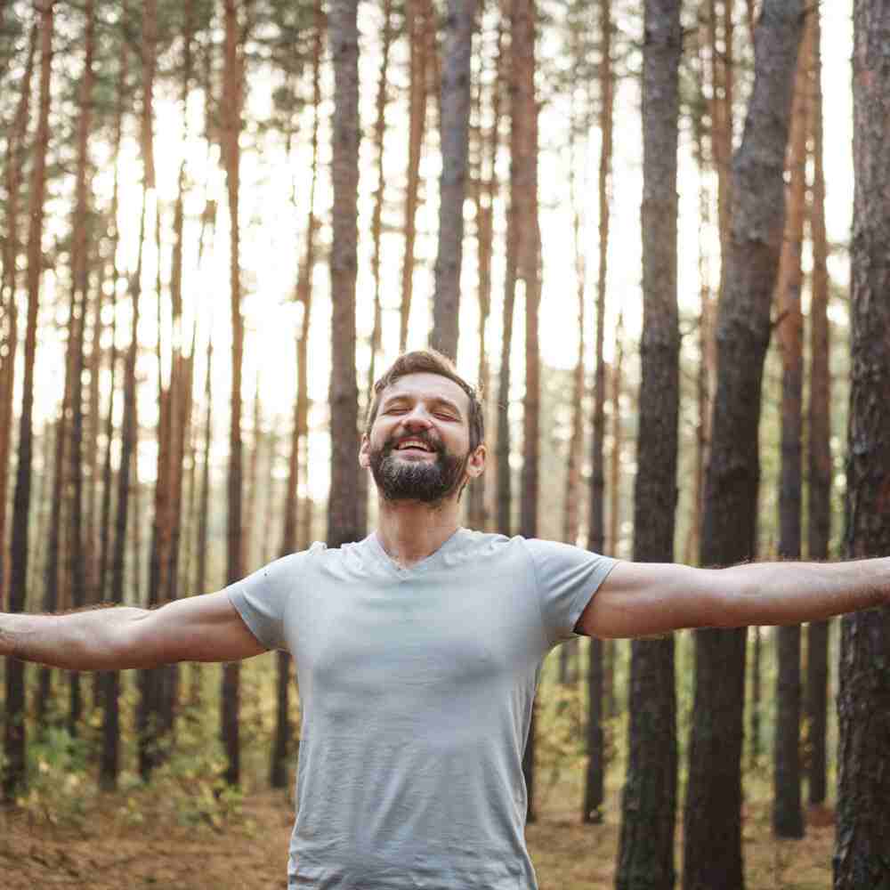 Person with outstretched arms, showing mental health’s impact on physical health in NYC.