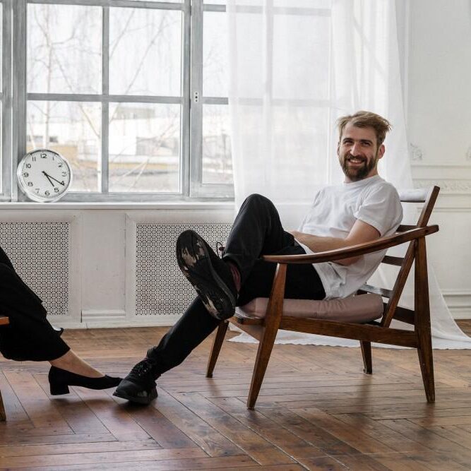 man relaxing at home on chair