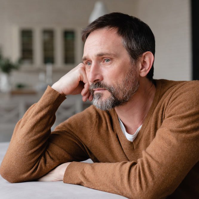 Bored tired sad mature middle-aged man depressed lonely having no visitors of his children.