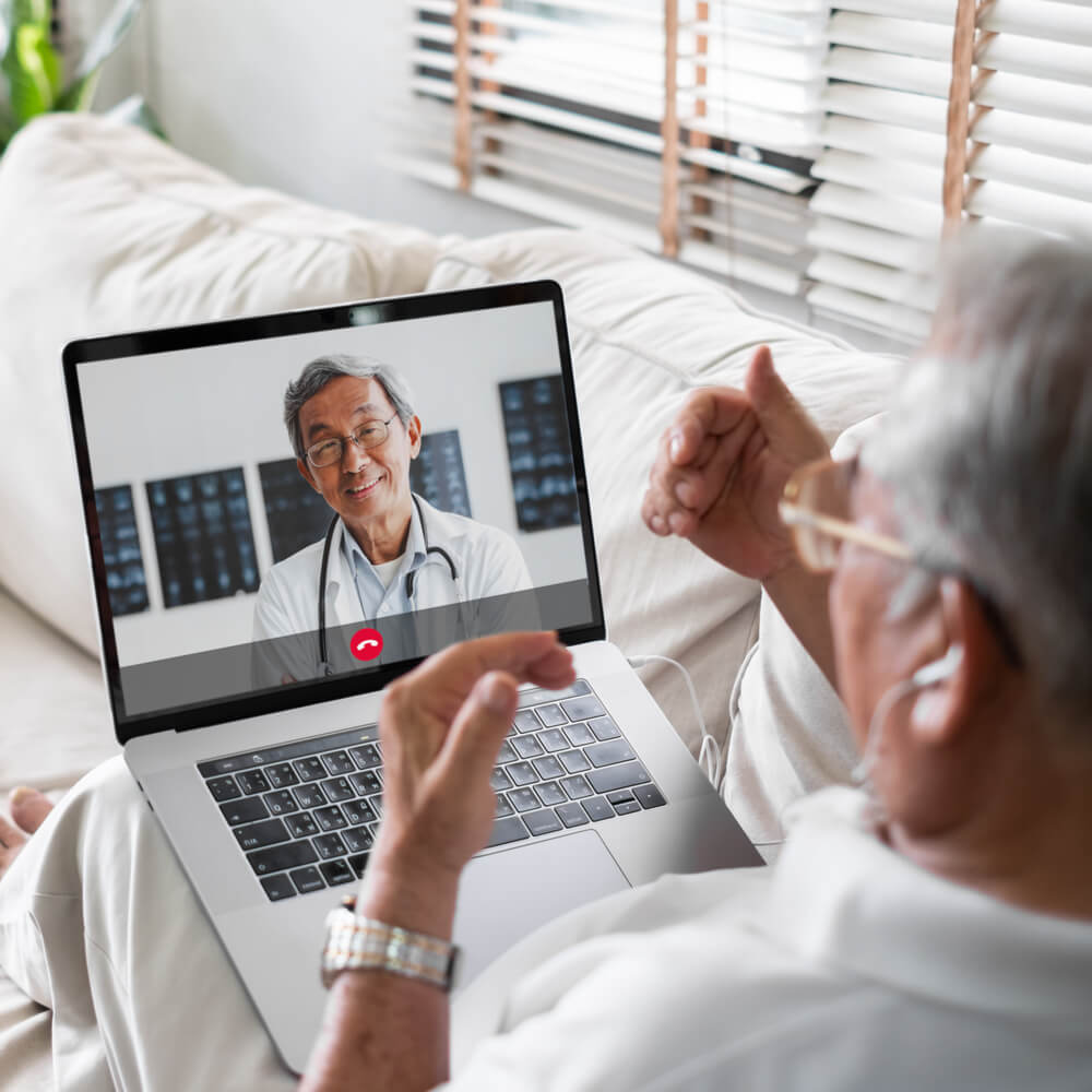 Senior person on a video call with a doctor, explaining teletherapy in NYC - Uncover Counseling.