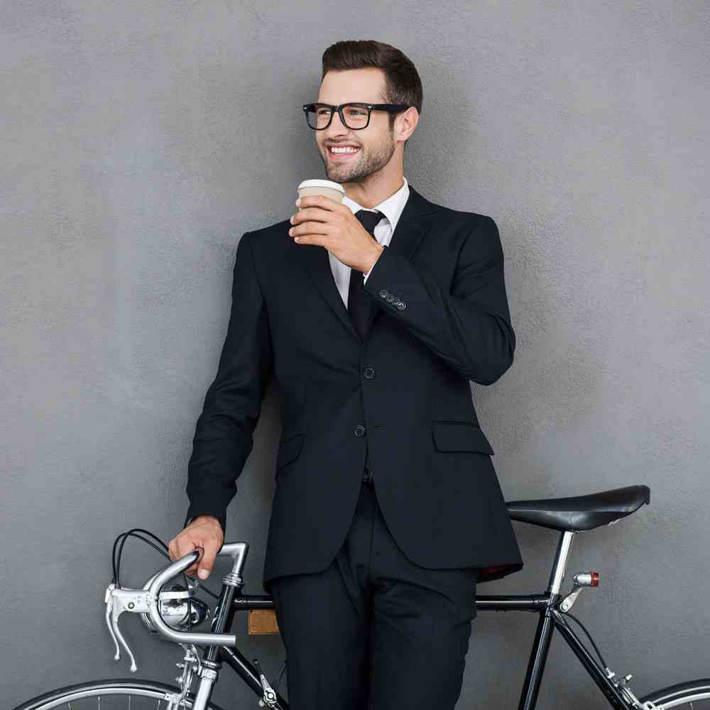 Person holding a coffee cup, questioning the pursuit of perfection in NYC - Uncover Counseling.