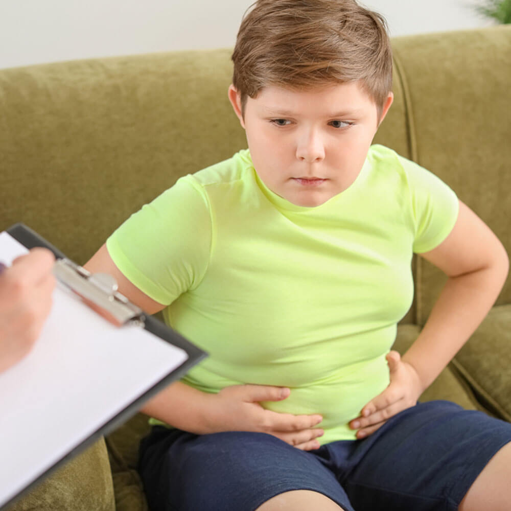 Child sitting during consultation, linking mental health and childhood obesity in NYC.