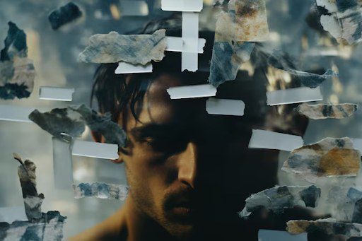A collage of various stones displayed on white shelves against a blurred background.