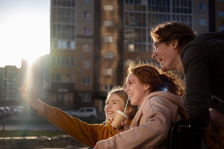 happy friends outdoors taking selfie side
