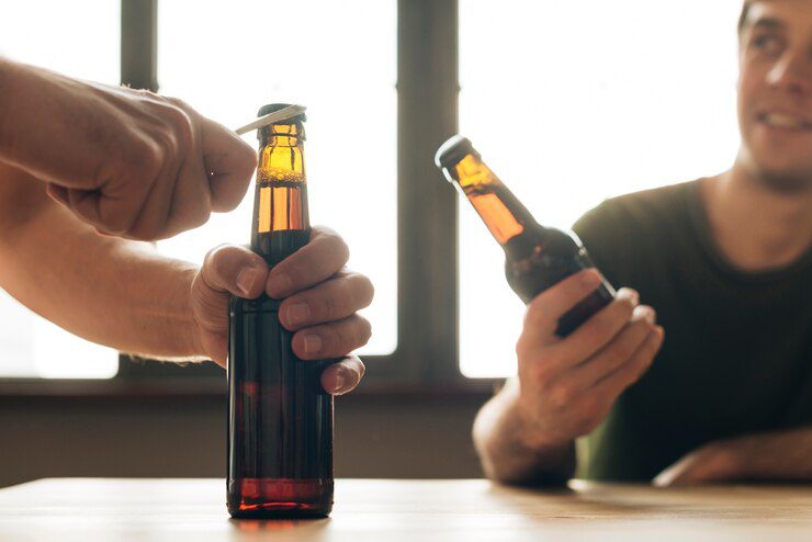 man looking person opening brown beer bottle restaurant 23 2148160137 Uncover Mental Health Counseling