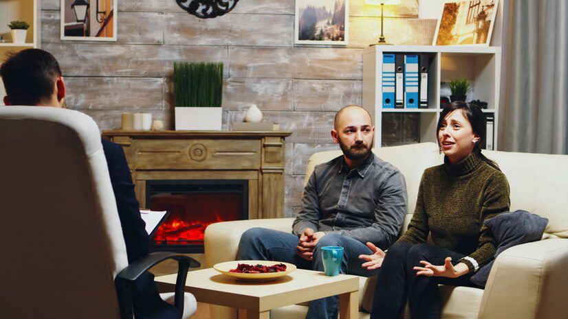 sad boyfriend sitting couch couple therapy with her girlfriend bad relationship 482257 25262 Uncover Mental Health Counseling