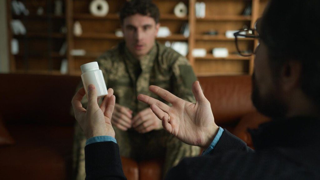 Unrecognizable psychologist therapist hands holding medical drug drops jar pills talk discuss