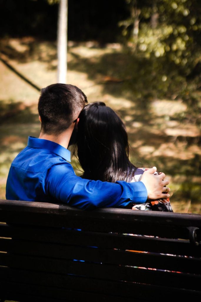 a couple sitting on the bench