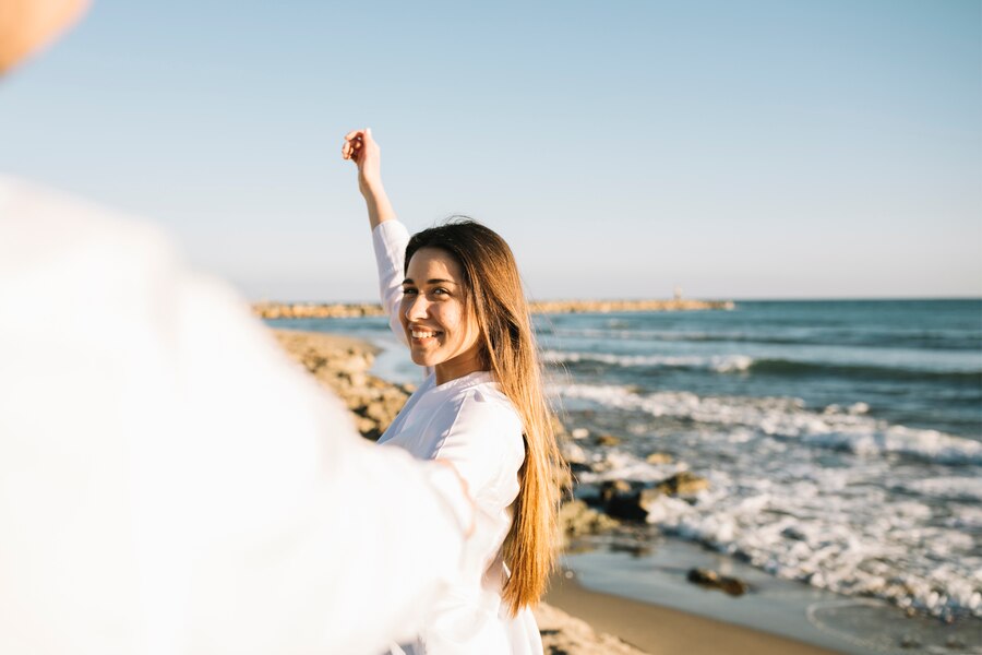 secret to a happy life - a couple enjoying the beach