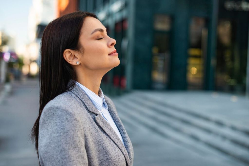 mastering square breathing - a businesswoman outdoors in the city