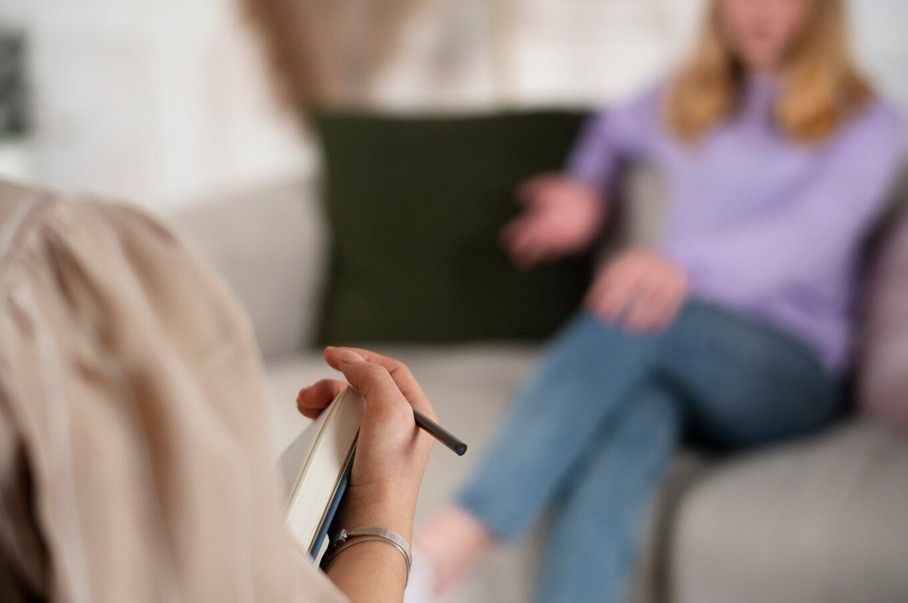 emotional dysregulation - young girl talking to therapist