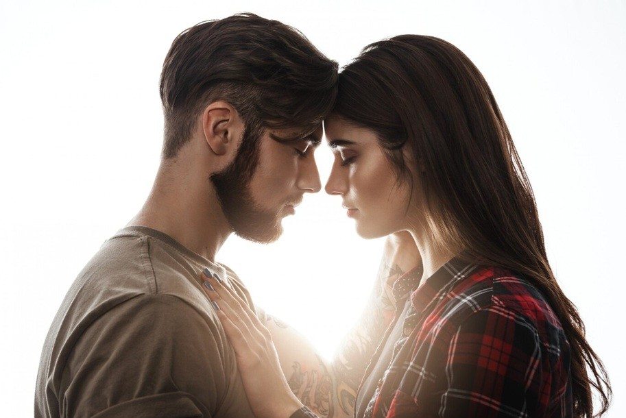 responsive desire - Head to head. Woman holding hands on man's chest.